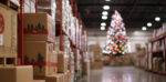 A decorated Christmas in a warehouse full of cardboard boxes
