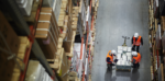people managing stock in a warehouse