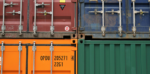 Four stacked shipment containers in different colours