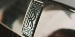 A close-up of the Rolls Royce emblem, showcasing its intricate design and luxurious craftsmanship.